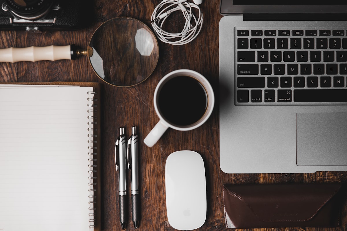 Creative workspace showing a founder building their startup while managing social media content
