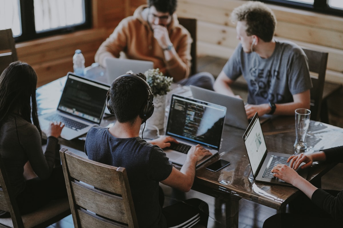 Solo founder working on content marketing strategy with multiple screens showing analytics and social media